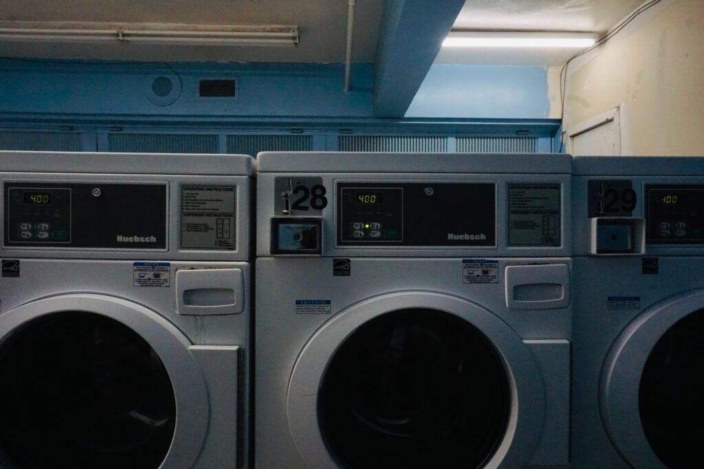 Three Huebsch washing machines in a row