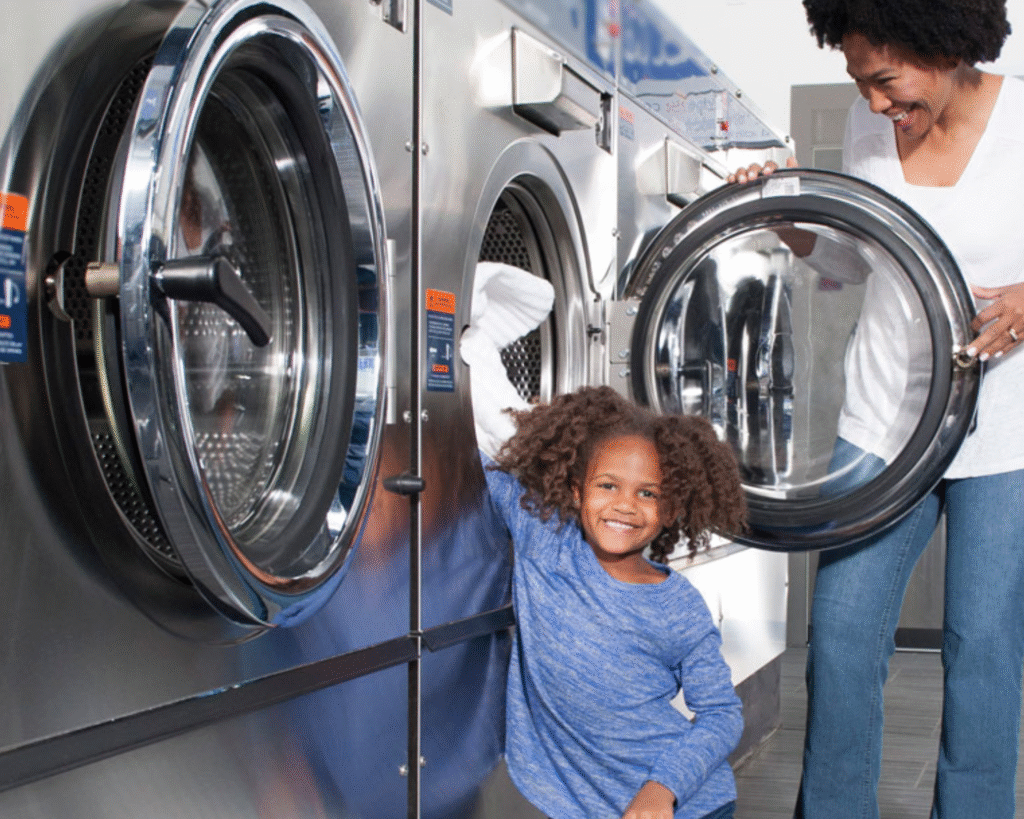 Inside view of a commercial dryer drum in a Homewood laundromat.