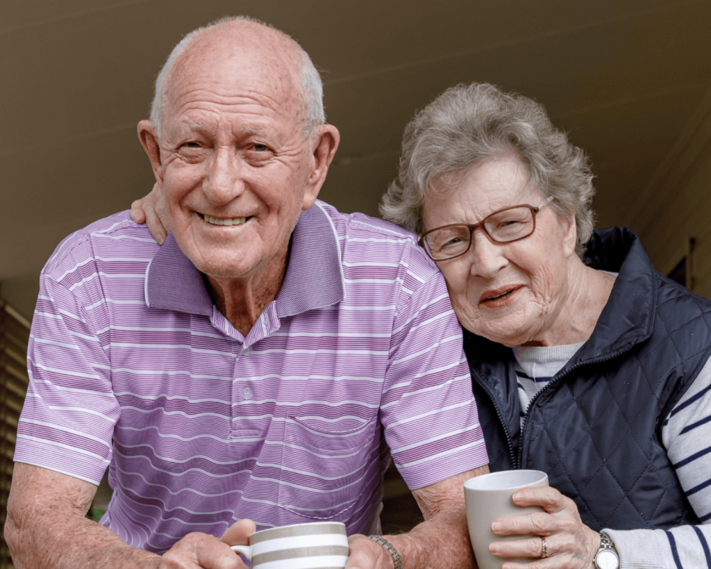Smiling older couple enjoying coffee together