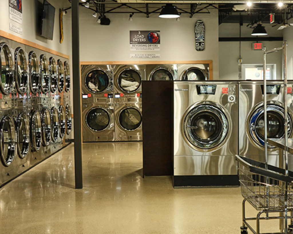 High-capacity coin-operated laundry machines displayed in a Bessemer laundromat.