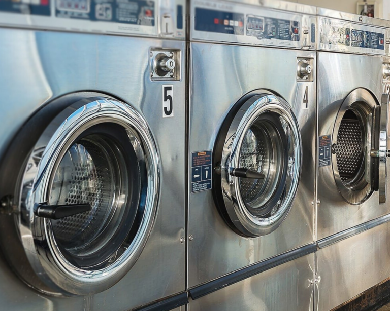 Coin-operated commercial washers with stainless steel doors