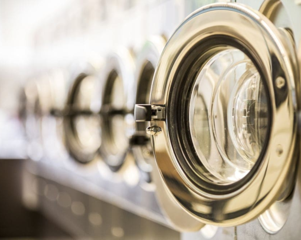 Commercial laundromat washers prepared for daily use, serviced by Southeastern Laundry teams in the Forsyth area.