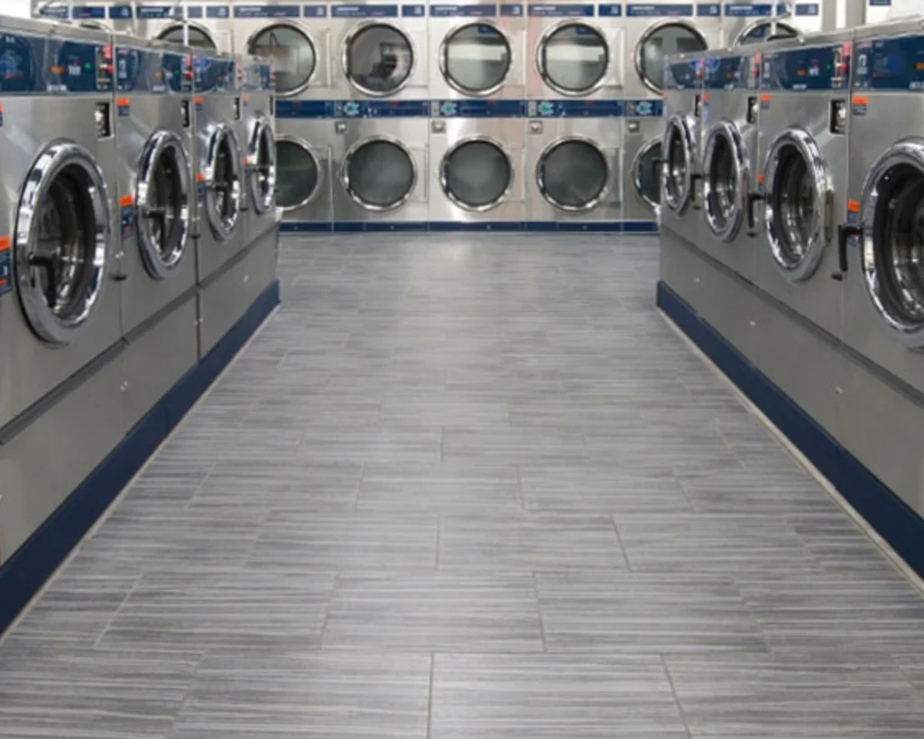 Rows of coin operated washer and dryer machines supplied by Southeastern Laundry in Phenix City.