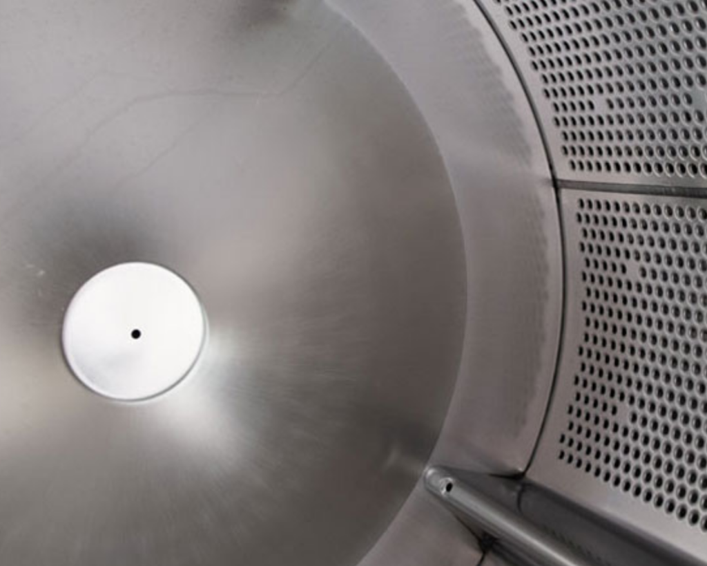 Interior drum of a commercial washer used in laundromat equipment solutions supported by Southeastern Laundry in Macon, GA.