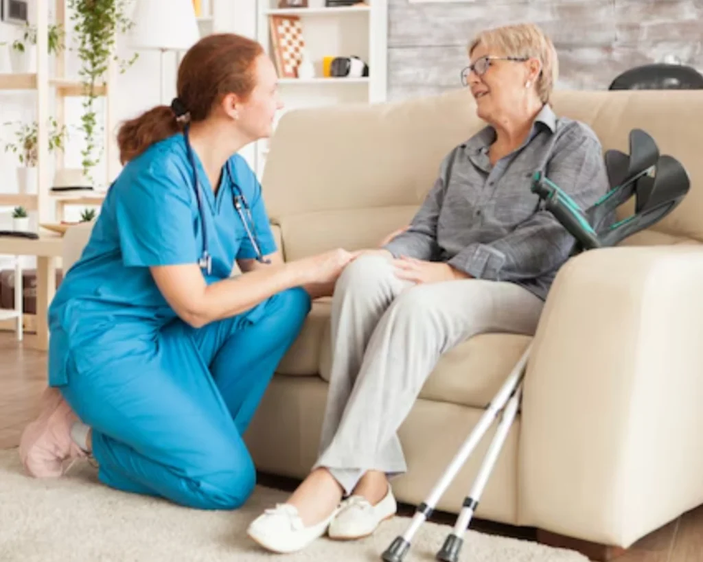 Caregiver assisting resident demonstrating structured processes behind OPL laundry bottlenecks solutions in care homes