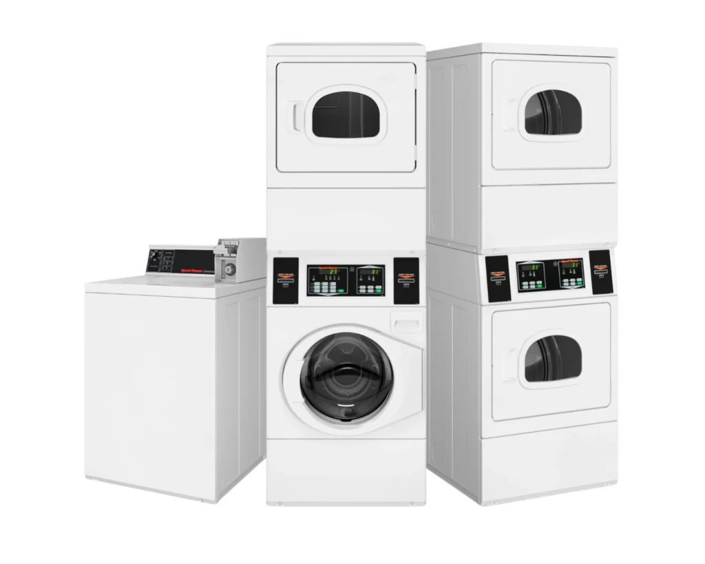 Full lineup of machines displayed during a Speed Queen laundromat equipment expo in a commercial laundry setting.