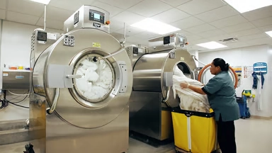 Unimac commercial laundry operator