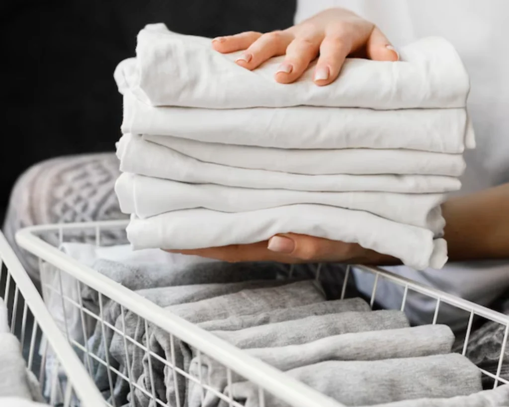 Clean folded linens showing how on-premise laundry reduces costs through faster OPL turnaround