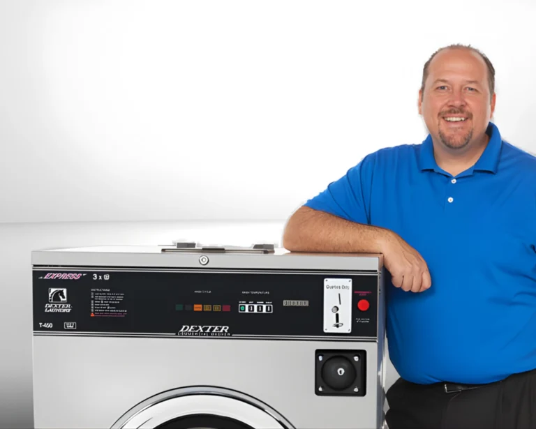 Service representative standing beside Dexter® commercial laundry equipment for Southeastern Laundry support in North Carolina.