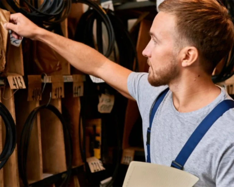 Southeastern Laundry technician checks organized commercial laundry service parts for Tampa equipment support.