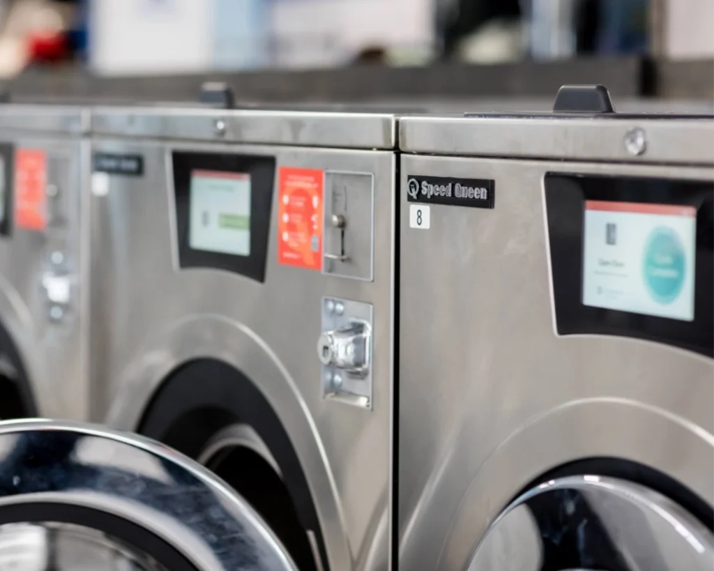 Speed Queen® commercial washers installed in a Virginia apartment community laundry room.