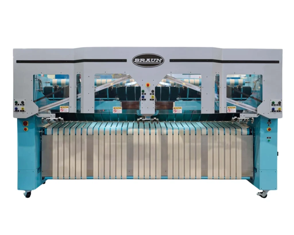 Industrial linen finishing equipment covered by an on-premise laundry emergency plan for safe shutdown and restart.