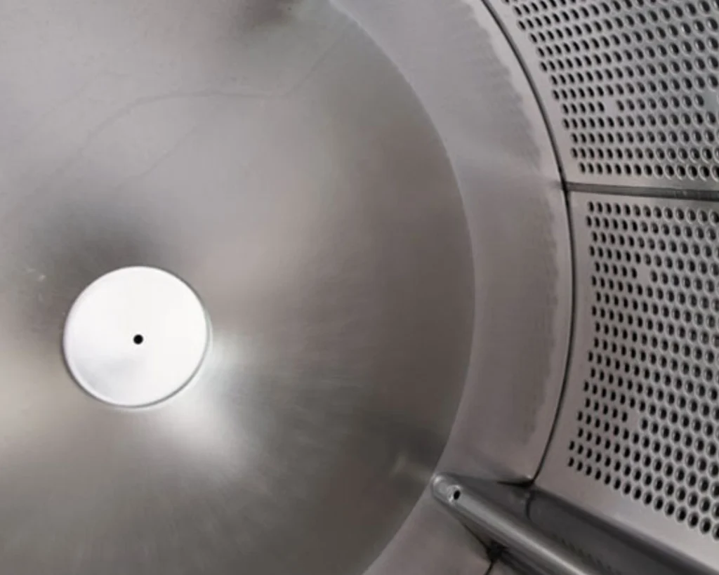 Stainless steel commercial laundry drum designed for dependable OPL performance and better control of on-premise laundry costs.