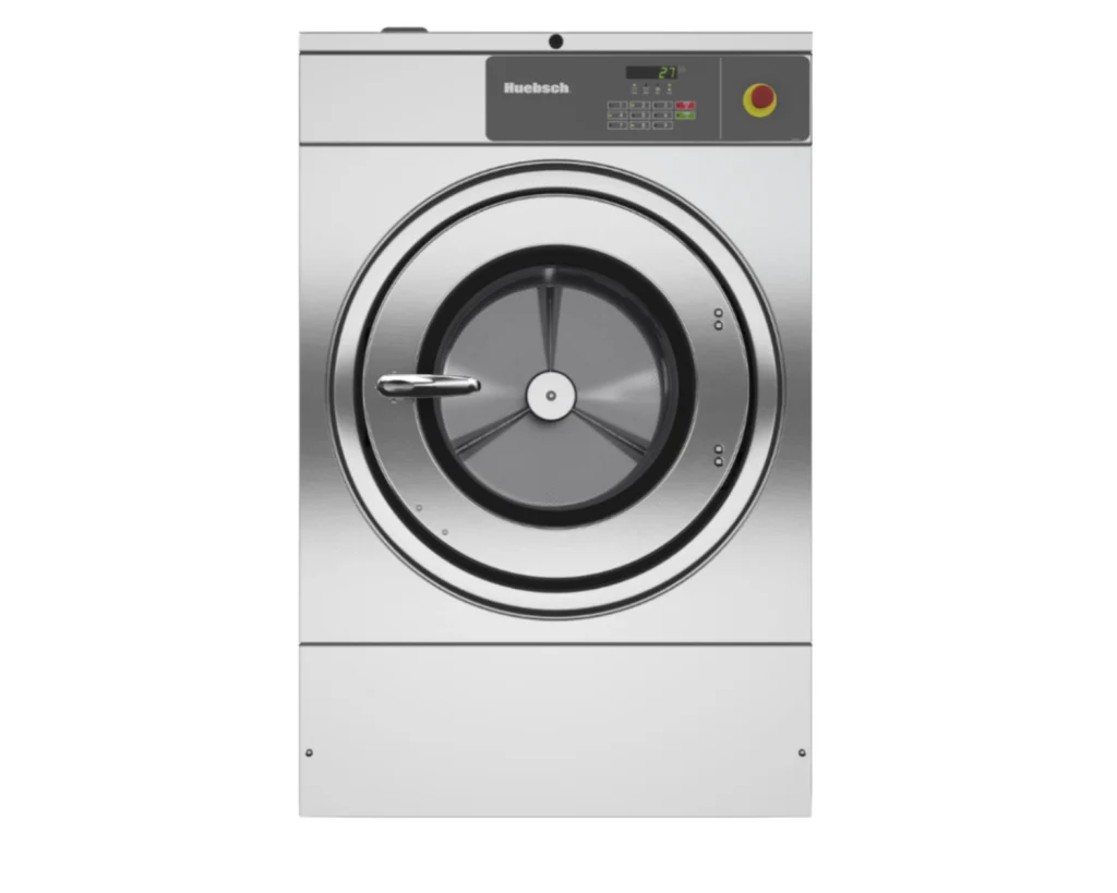 Front view of a Huebsch commercial dryer used in a commercial laundry room ventilation system.